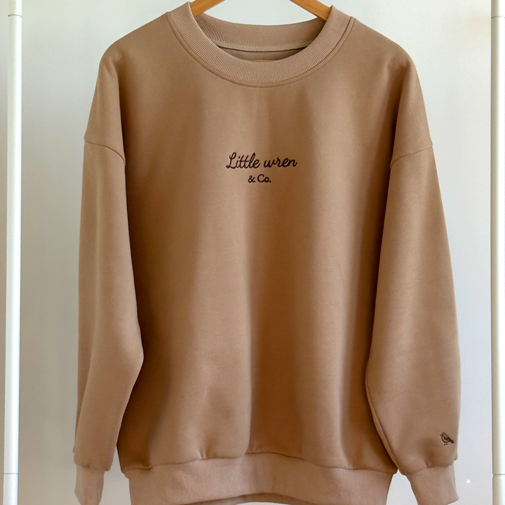Brown sweatshirt with 'Little Wren & Co.' text on a white background