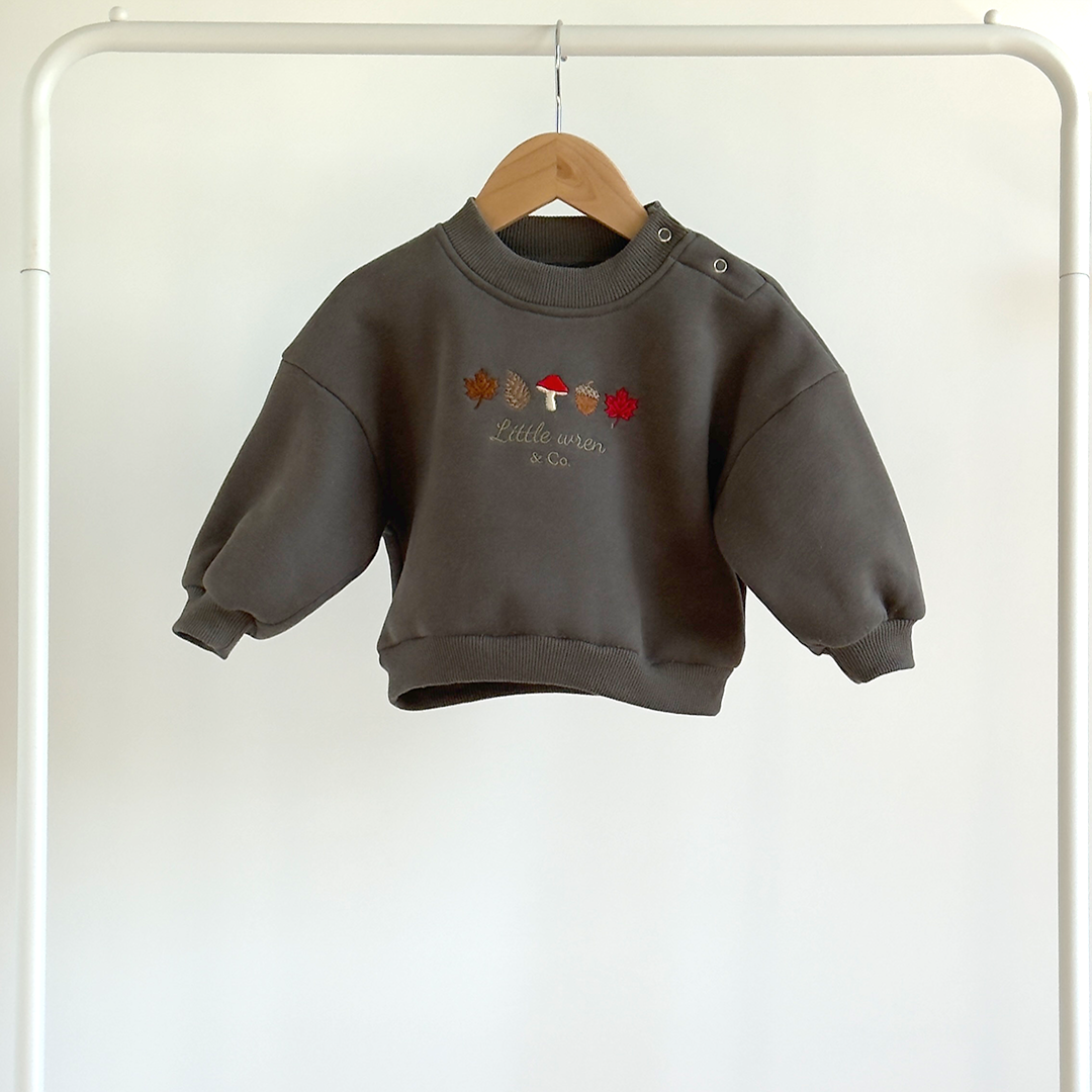 Children's dark gray sweatshirt with embroidered design on a white background